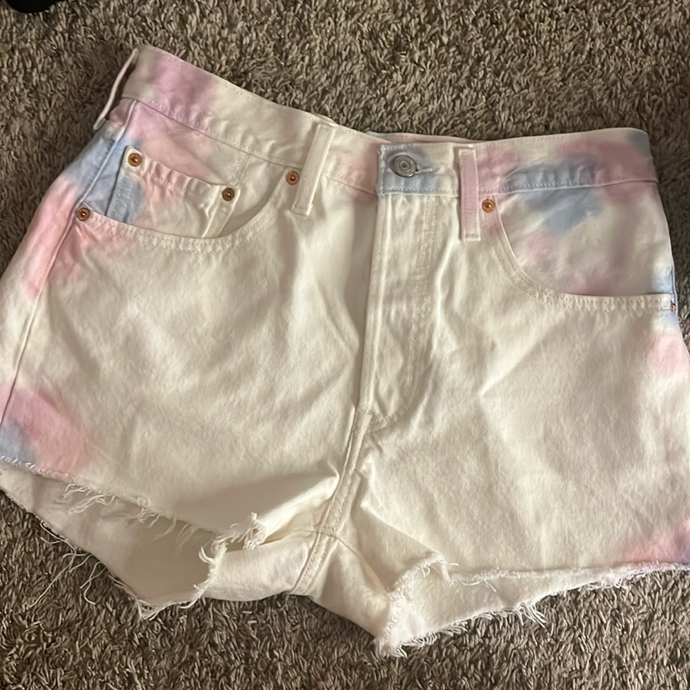 I am selling Levi’s shorts they are white with tie dye and size XL